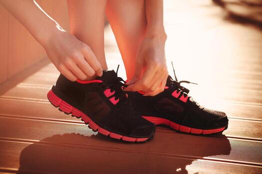 Woman tying sneaker